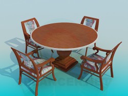 Round table on a thick stalk with chairs in the complete set