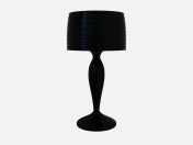 Lâmpada de tabela em uma performance escura preto da lâmpada de mesa