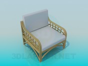 Chair with wicker armrests and legs