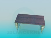 Table with scalloped legs