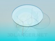 Glass round table on thin legs