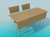 A desk with chairs