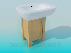 Massive wash basin on a small wooden cabinet